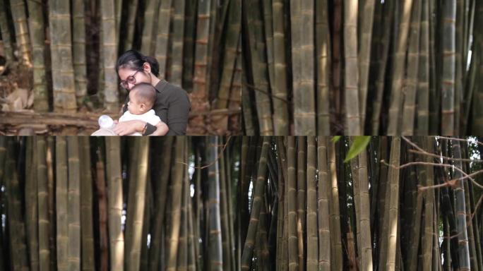 妈妈和宝宝在大竹林玩耍