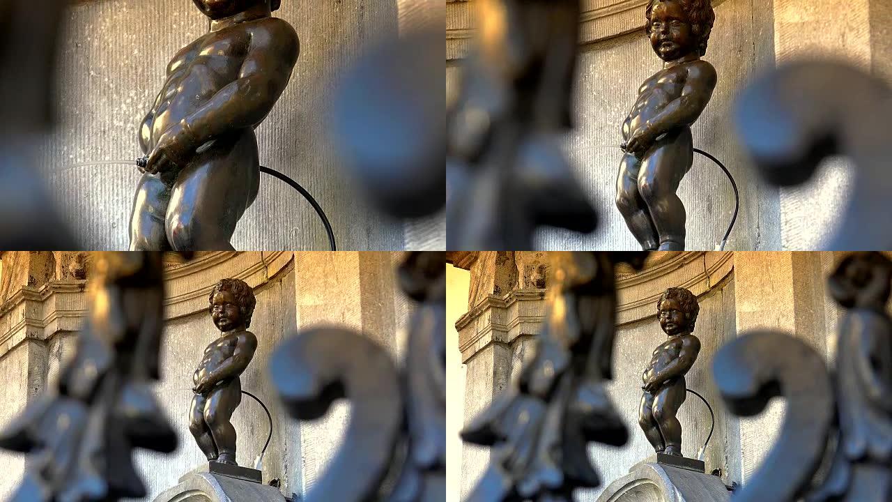 布鲁塞尔的撒尿小童雕像。比利时布鲁塞尔，一个在美丽夏日小便的男孩雕像。