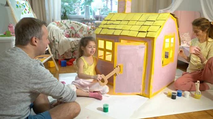 Father gives happy little girl a key to her new ca