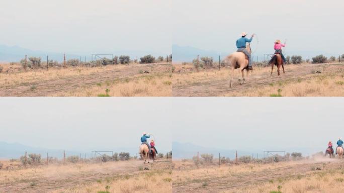 牛仔和女牛仔在土路上骑马