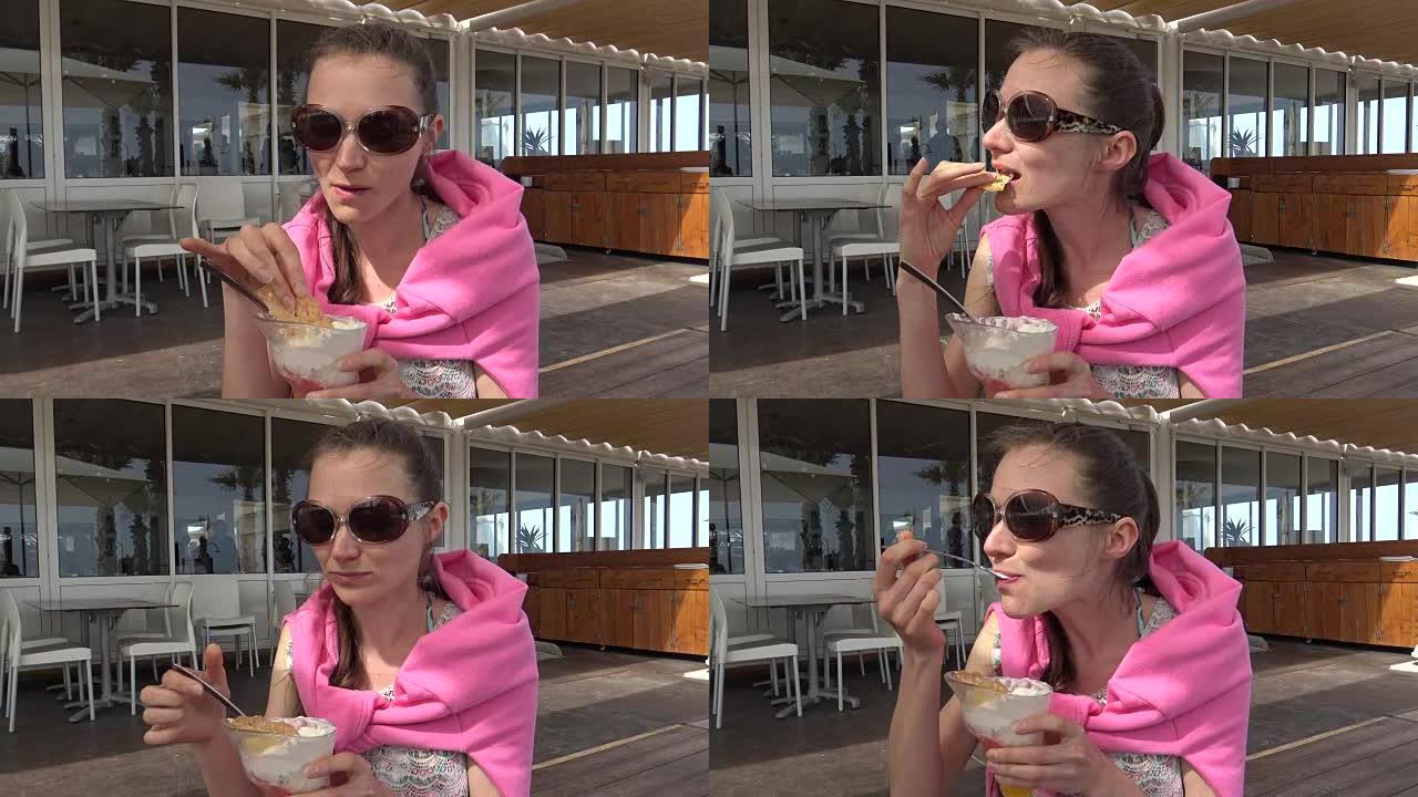 年轻女子在咖啡馆吃冰淇淋甜点