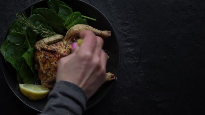 Oven Roasted Cornish Game Hen on dark background w