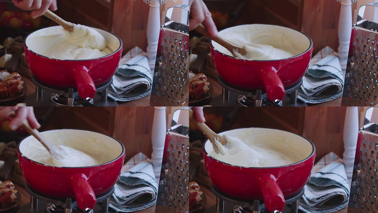 在锅中准备瑞士奶酪火锅，配面包