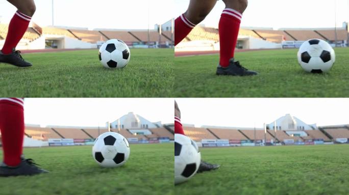 足球运动员展示步法和足球运动员在慢动作中踢球和射门