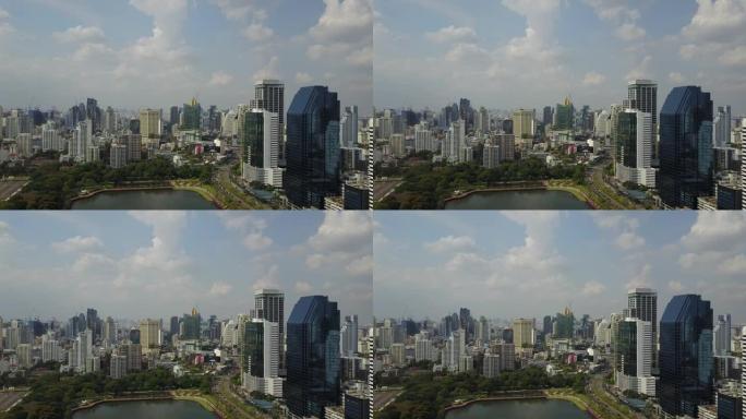 泰国，曼谷-2018年4月1日: 在商业区阿索克区的公共本贾基蒂公园上空飞行。空中全景城市景观4K