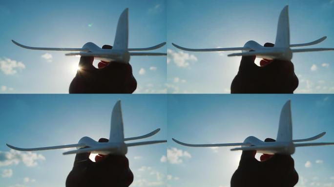 手握着一架玩具般的飞机，冲向天空。梦想和良好的创业理念