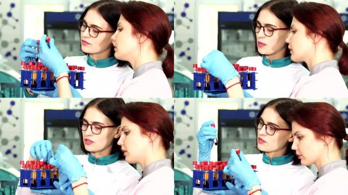 两位年轻的女性研究人员正在研究血液试管
