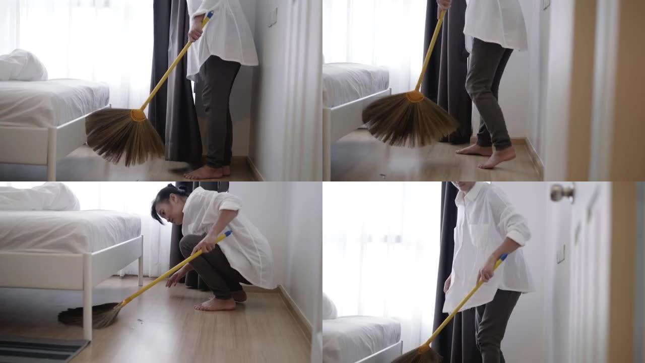 年轻的家庭主妇用刷子和簸箕清洁一尘不染的地板，非常卫生-库存视频