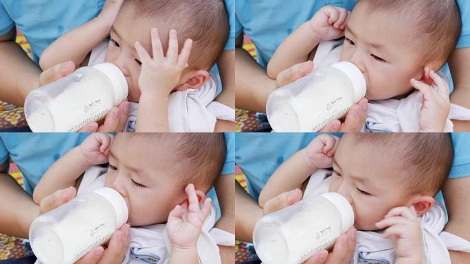 男婴喝奶瓶中的牛奶