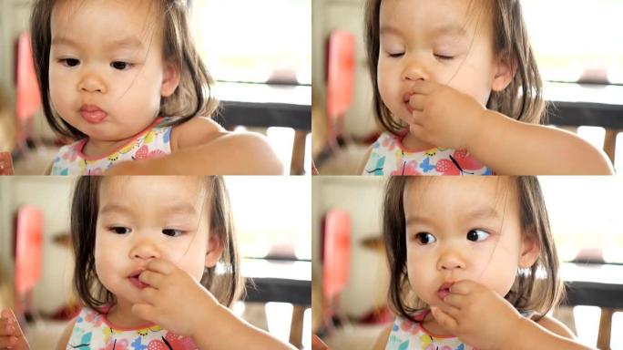 亚洲女婴吃食物。