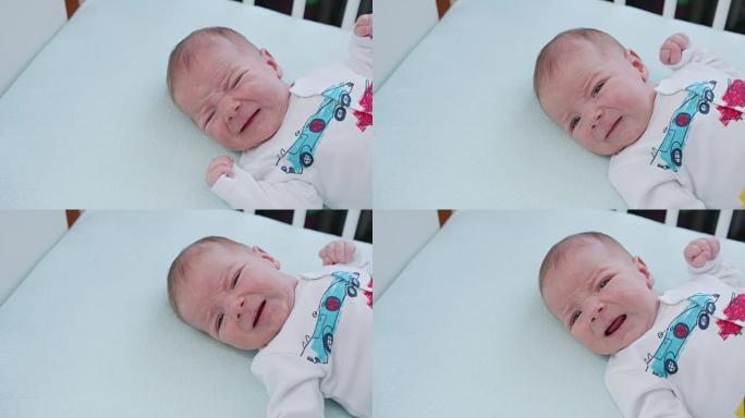 婴儿躺在家里的床上