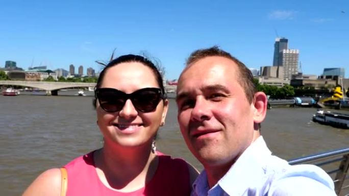 情侣在4k慢动作中自拍泰晤士河和伦敦碎片摩天大楼