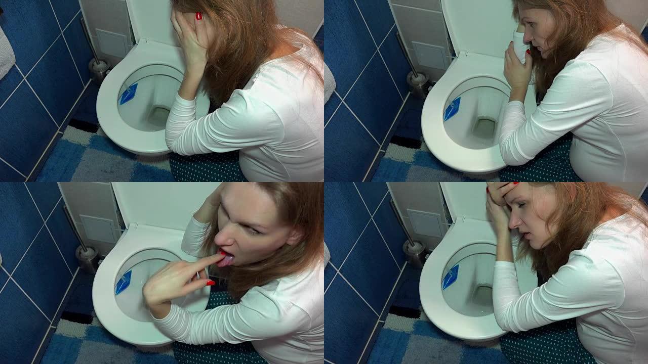 怀孕的女孩在浴室的厕所呕吐。悲伤的女人晨吐
