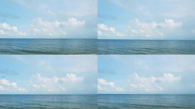 海景，海景。美丽的蓝海，多云的天空在清新的日子里，海浪冲击着沙滩海岸的声音。