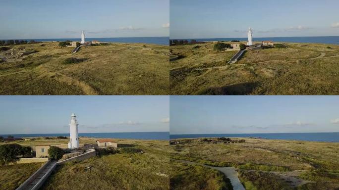 4k鸟瞰图。无人机射击。地中海景观。塞浦路斯。海岸上的灯塔。清晨。低海拔的锋面跨度到海边。