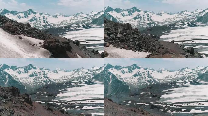 空中拍摄美丽的自然白雪皑皑的岩石山峰景观