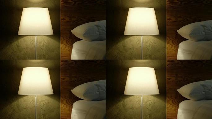卧室床上无眠的特写台灯