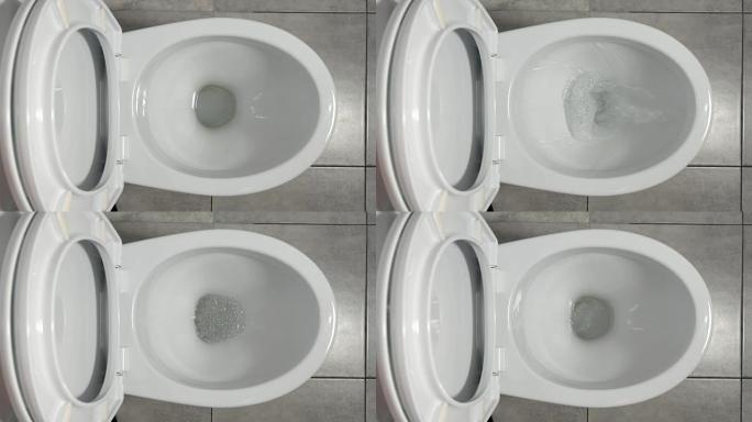 俯视图: 水在白色厕所中流动
