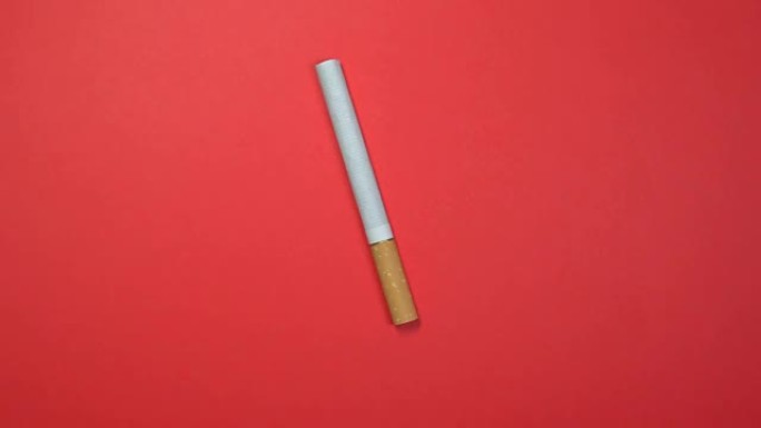 香烟特写，微距拍摄，在旋转的红色背景上快速旋转。