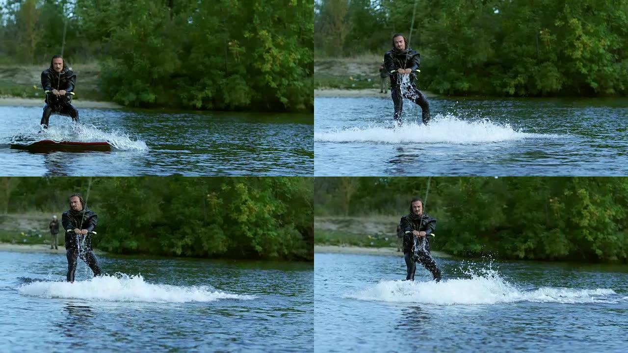 滑水者骑在宁静的水上。男骑手极限生活