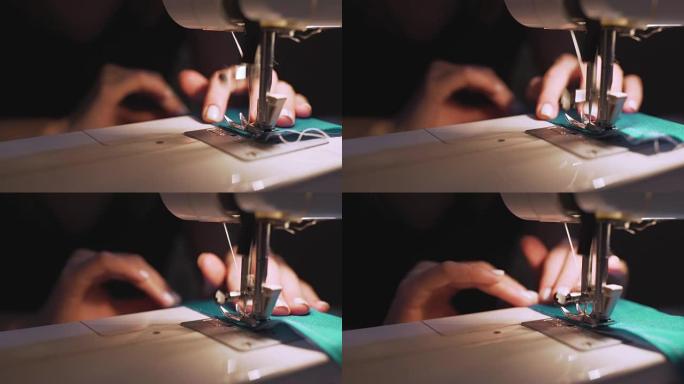 在缝纫机上工作的女性手的特写镜头。年轻女性概念设计师在家里做缝纫机。时尚和剪裁