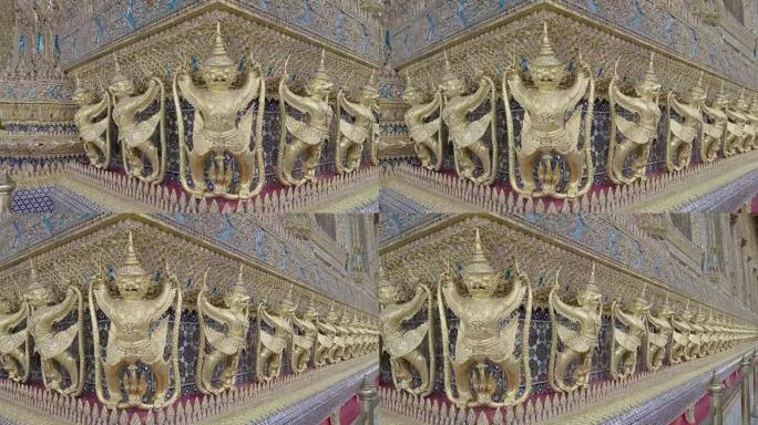 装饰金色人物环绕泰国曼谷Wat Phra Kaew寺的外部机器人