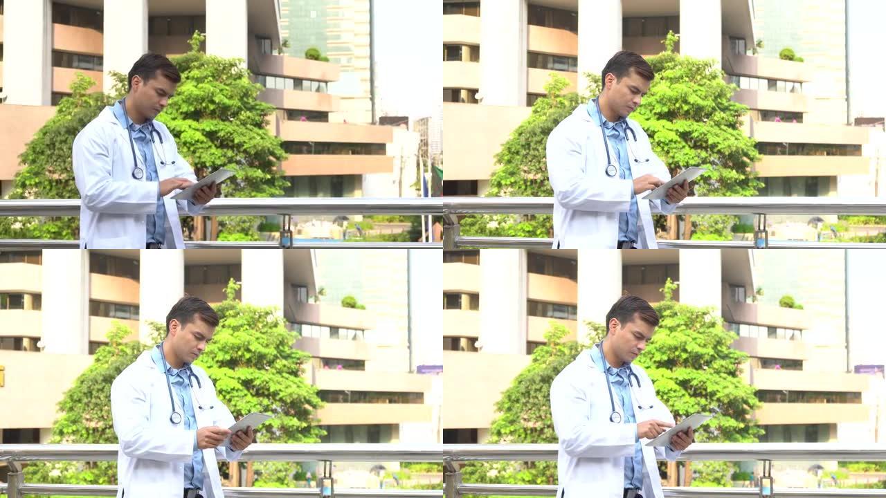医生看数字平板电脑在病人医院的报告