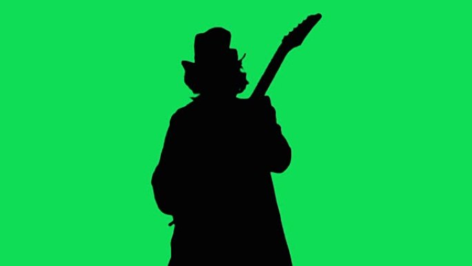 帽子里的酷摇滚吉他手在绿屏上弹奏电吉他