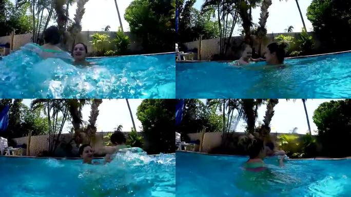 Mother and baby in swimming pool in summer time