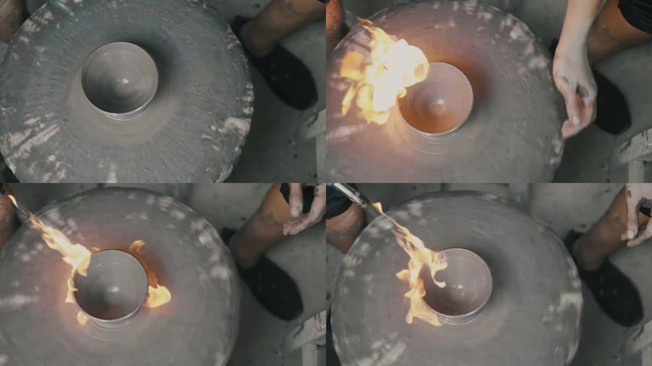 关闭一个陶工的手，在圆轮上创建一个杯子，同时使用喷火泡沫-股票视频