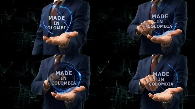 商人在他的手上展示了哥伦比亚制造的概念全息图