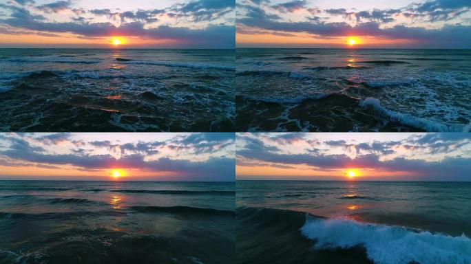 日出，海浪上有戏剧性的云层