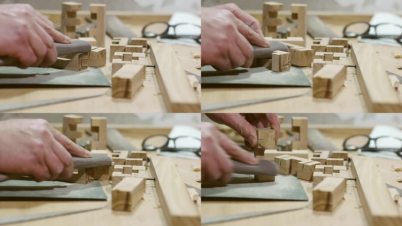 用砂纸研磨木材工艺品