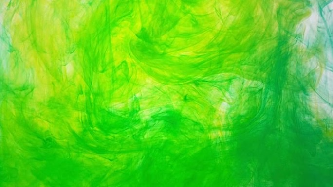 油漆在水中运动。有色水滴混合溶解。一滴彩色墨水在水中旋转。丙烯酸彩色墨水在水中旋转的抽象背景