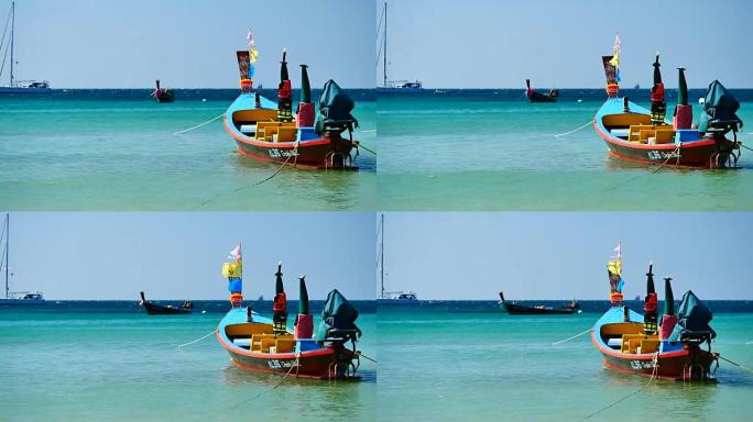 旺季中的旅行视频长尾船转换船游览，以服务于在晴天巡游安达曼岛海岸海滩的游客以及旅行和运输概念中的好天