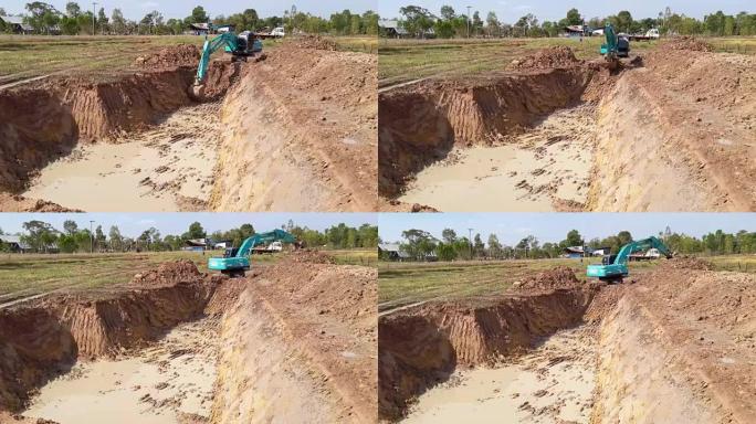 Backhoe dug a pond to store water for use during t