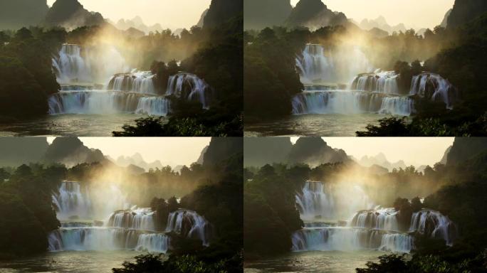 日出鸟瞰越南的班戈瀑布和中国的德天瀑布，位于边境附近，人们可以看到这两个国家的瀑布。