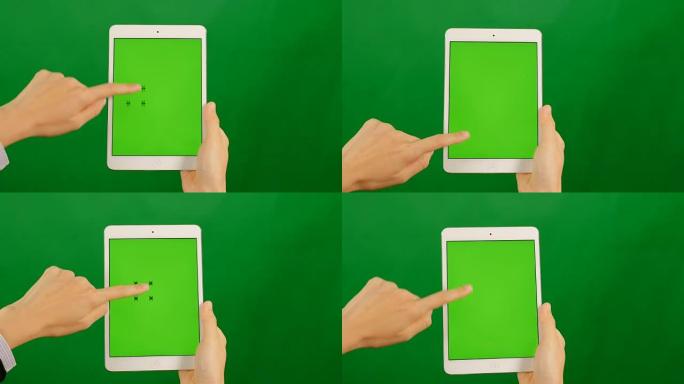 女商人在绿色背景上使用空白的绿屏平板电脑。