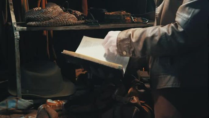 Woman pages through a book before leaving