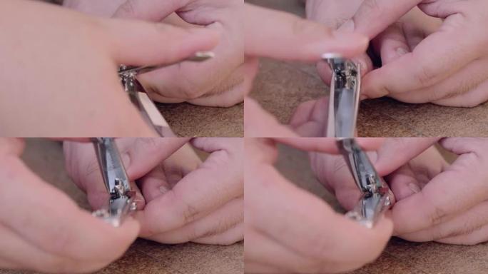 CU: 男人用指甲刀在脚上剪指甲