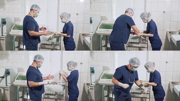 医生团队正在为手术做准备。护士助理帮助外科医生戴上白手套。背景医疗工具。健康观念，在医院工作。诊所的