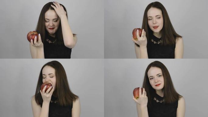 开朗的年轻女子吃红苹果