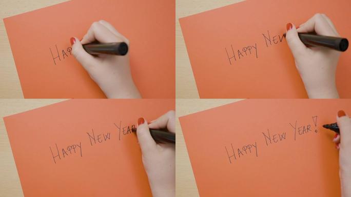 年轻女性用黑色记号笔在红纸上写下新年快乐