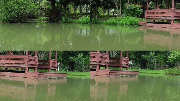 花园水边的传统泰国风格凉亭。公园池塘附近的泰国凉亭。
