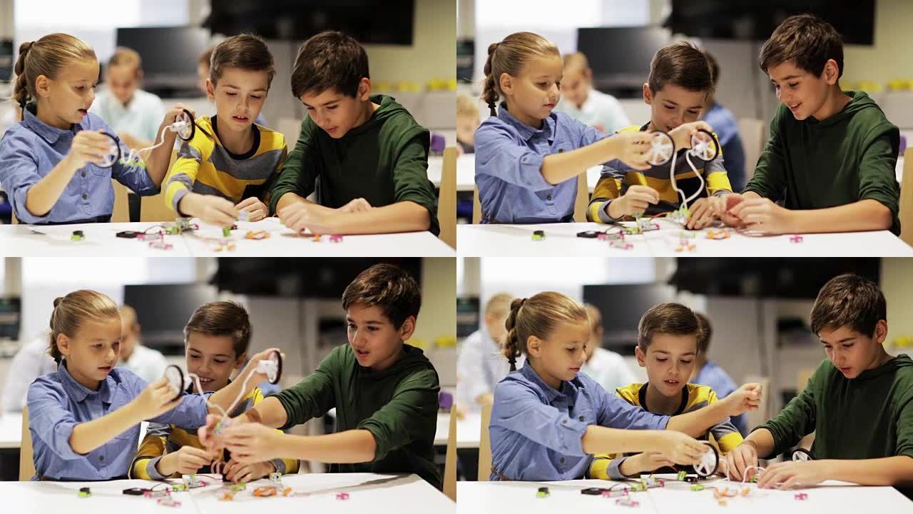 一群孩子在机器人学校课程中学习创建机器人