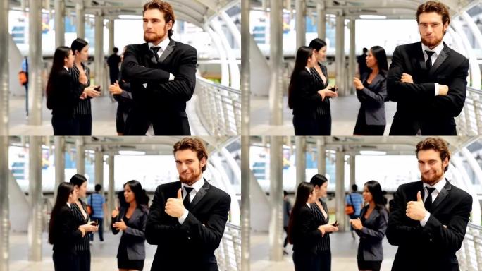 年轻商人肖像。年轻的白人男子穿着西装，打着领带，背景是中国女性。