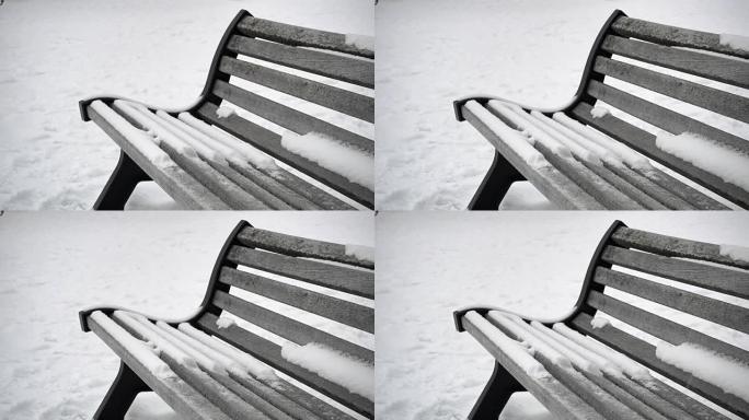白雪背景下的雪花覆盖曲线木凳细节