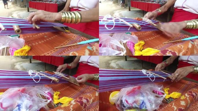 泰国当地人编织丝织布