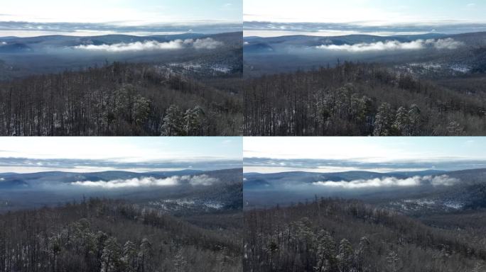 大兴安岭早春雪后雪色山岭云雾