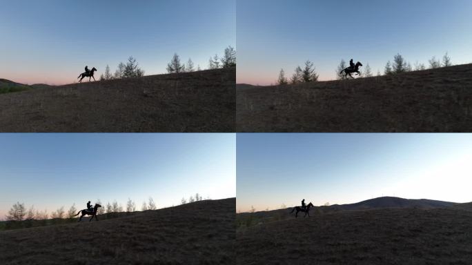 一人骑马狂野的山脊奔跑
